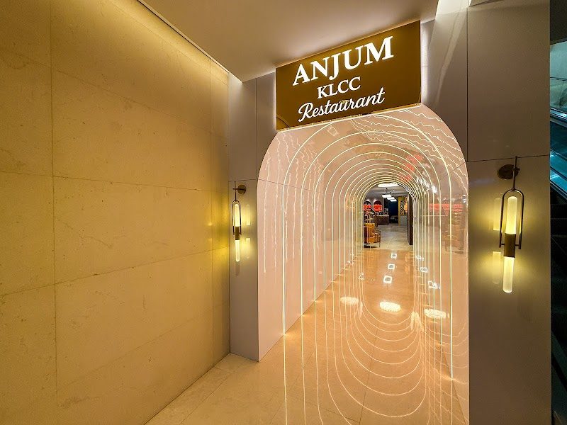 Illuminated arched entrance tunnel leading into Anjum KLCC Restaurant